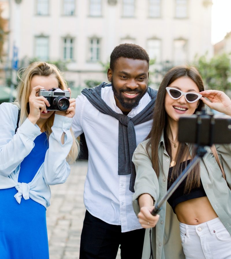 young-traveling-people-having-fun-and-sightseeing-in-city-multiethnic-friends-posing-together.jpg